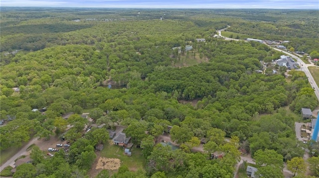 bird's eye view featuring a wooded view