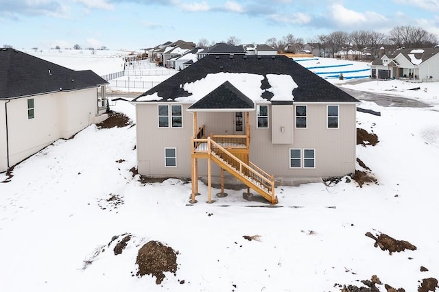 view of snow covered house