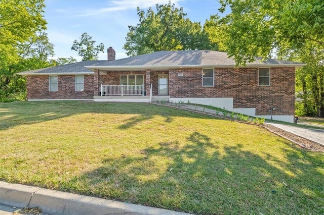 single story home with a porch and a front yard