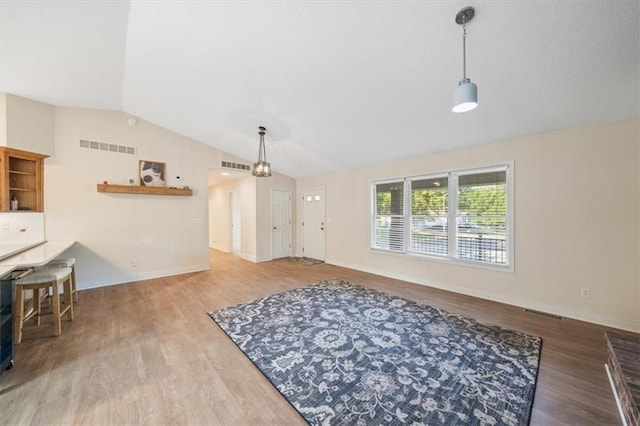 interior space with vaulted ceiling and wood-type flooring