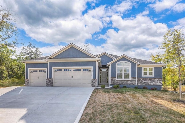 craftsman inspired home featuring a front yard and a garage