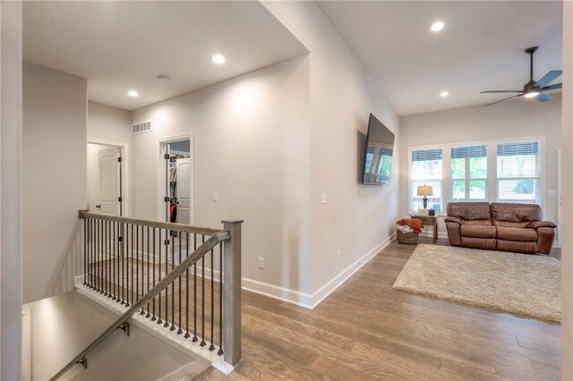 hall with wood-type flooring