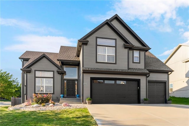 view of front of house with a garage and a front yard