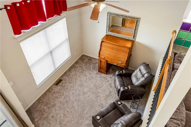 sitting room featuring carpet flooring and ceiling fan