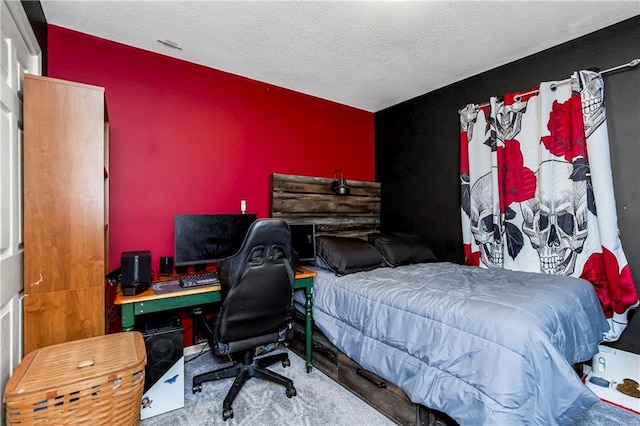 carpeted bedroom with a textured ceiling