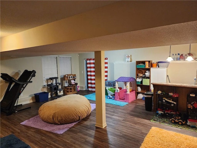 interior space featuring dark hardwood / wood-style floors and bar area