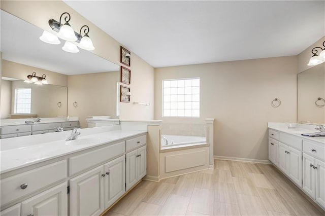 8500 NE 99th Ter, Kansas City, MO 64157 - bathroom featuring vanity, a tub, and an inviting chandelier