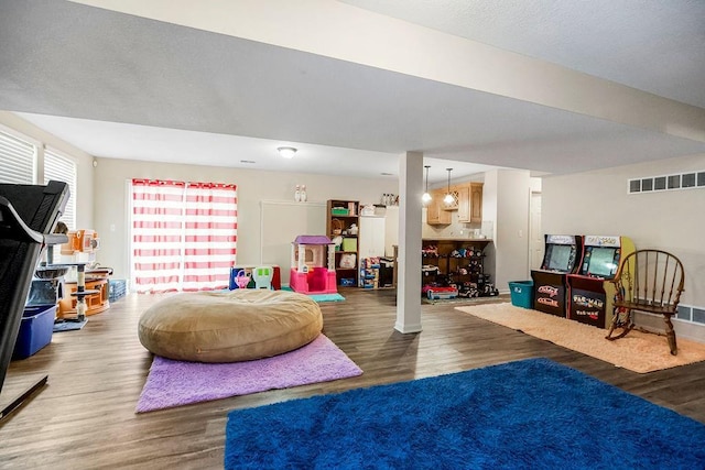 8500 NE 99th Ter, Kansas City, MO 64157 - recreation room with dark hardwood / wood-style flooring