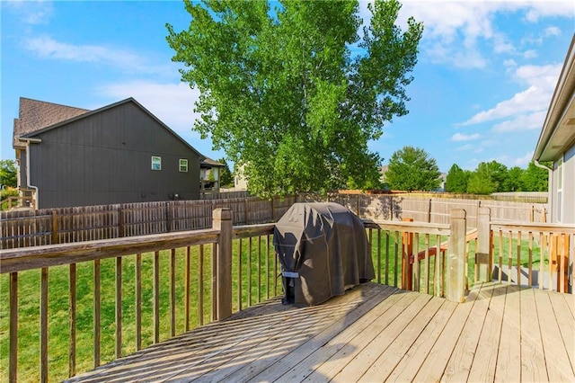 8500 NE 99th Ter, Kansas City, MO 64157 - wooden terrace with area for grilling and a yard