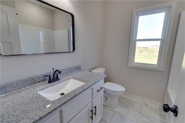 bathroom with vanity and toilet