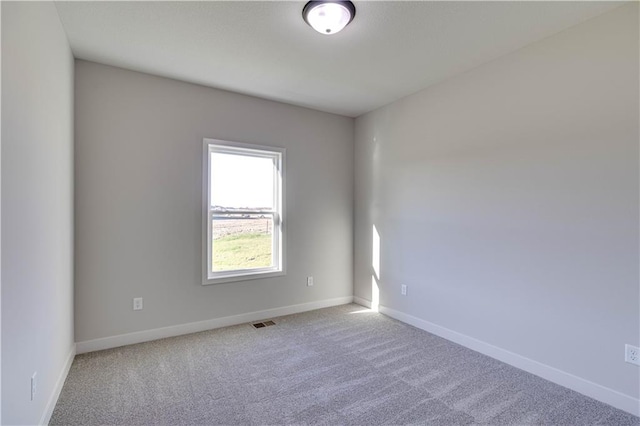 unfurnished room with carpet flooring