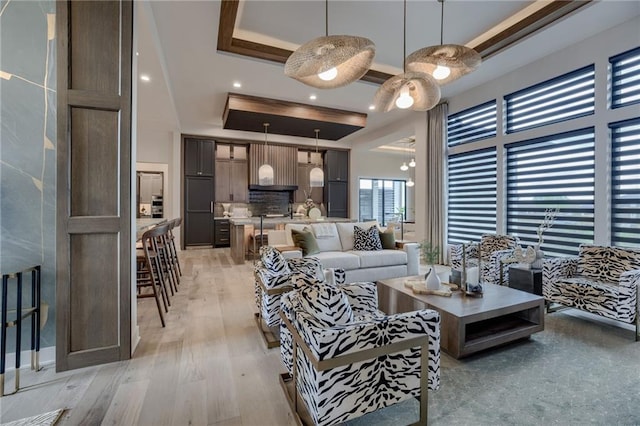4511 W 136th St, Leawood, KS 66224 - living area with light wood-type flooring and a tray ceiling