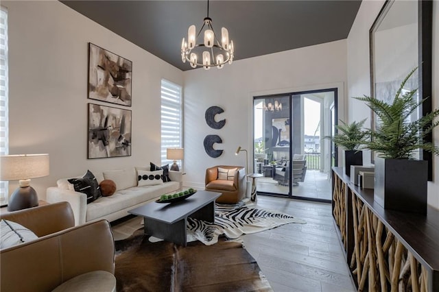 4511 W 136th St, Leawood, KS 66224 - living area with wood-type flooring and an inviting chandelier