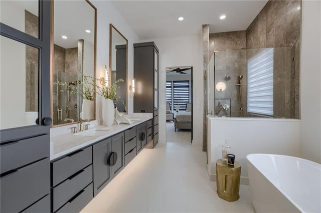 4511 W 136th St, Leawood, KS 66224 - ensuite bathroom featuring double vanity, a tile shower, a freestanding bath, and a sink