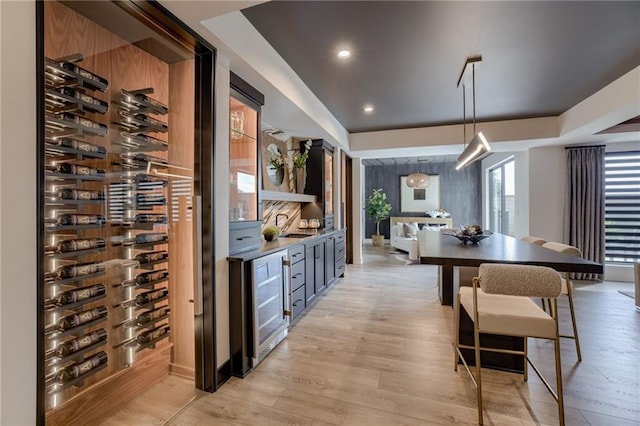 4511 W 136th St, Leawood, KS 66224 - wine room with beverage cooler, light wood-type flooring, and recessed lighting