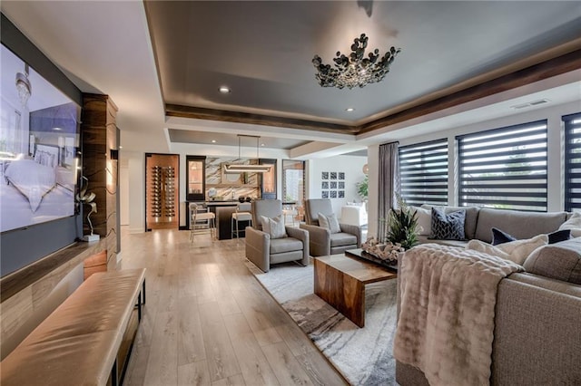 4511 W 136th St, Leawood, KS 66224 - living area featuring visible vents, recessed lighting, light wood finished floors, and a tray ceiling