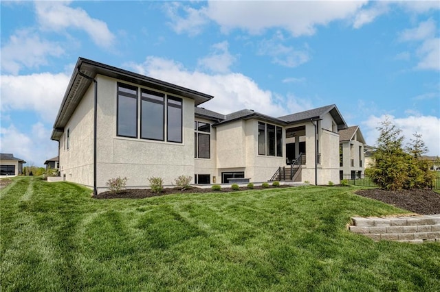 4511 W 136th St, Leawood, KS 66224 - rear view of property with a yard and stucco siding