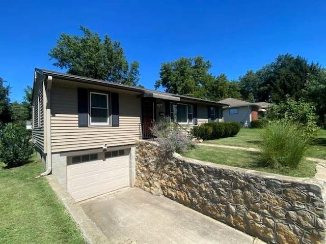 single story home featuring a front yard and a garage