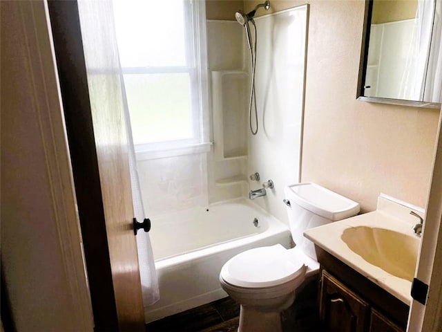 full bathroom with bathing tub / shower combination, vanity, and toilet