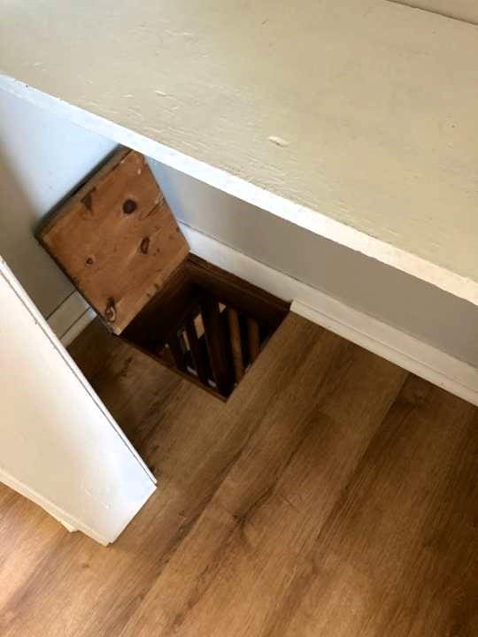 staircase with wood-type flooring