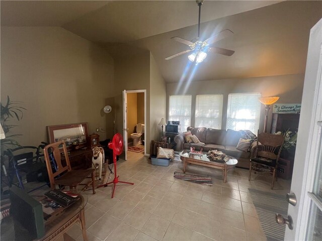 living room with high vaulted ceiling, ceiling fan, and light tile patterned flooring