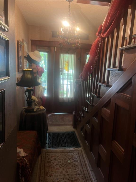 entrance foyer featuring a notable chandelier