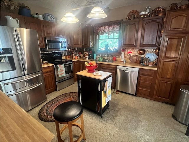 kitchen featuring dark brown cabinets, backsplash, appliances with stainless steel finishes, sink, and wooden counters