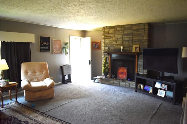 living room with a textured ceiling, carpet floors, and a stone fireplace