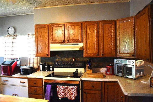 kitchen with white range with electric cooktop, decorative backsplash, crown molding, and a textured ceiling