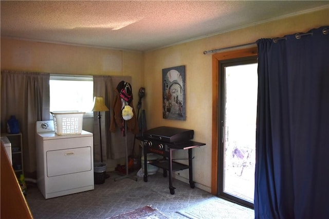 office space featuring a textured ceiling and washer / dryer