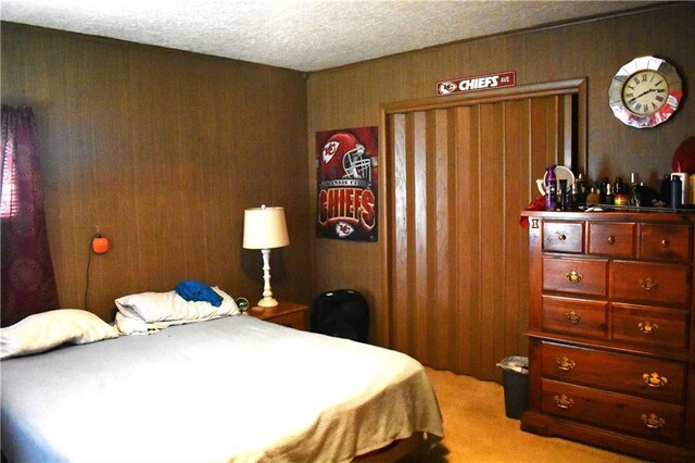 carpeted bedroom with a textured ceiling