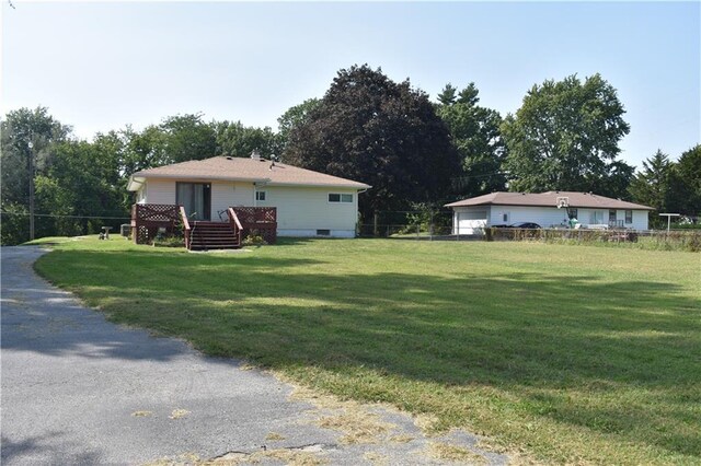 exterior space with a yard and a deck