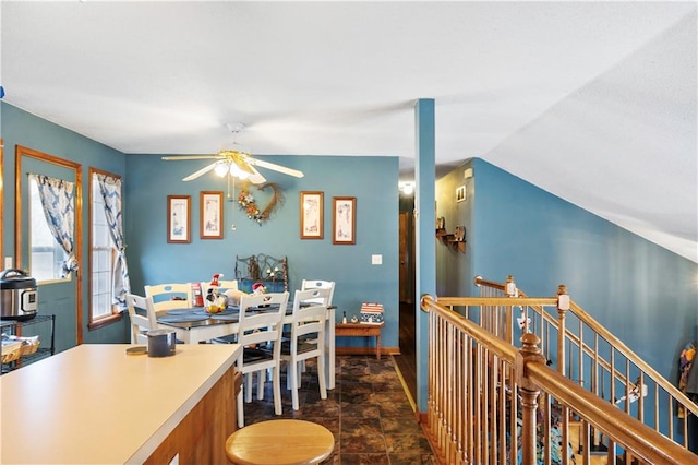 dining area featuring ceiling fan and vaulted ceiling