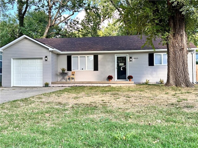 ranch-style home with a garage and a front yard