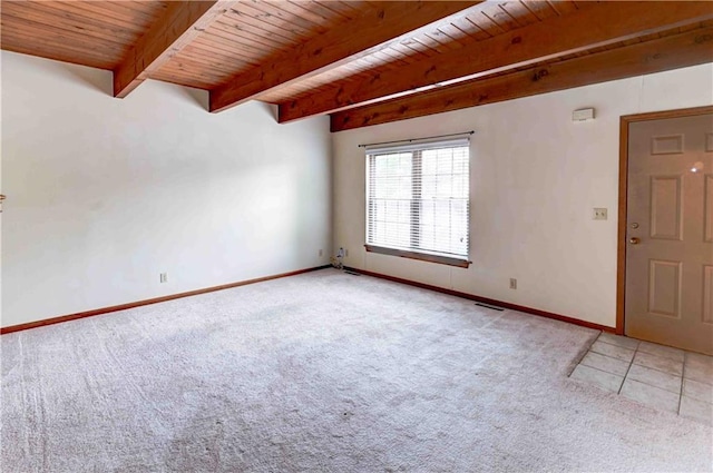 empty room featuring wood ceiling, light carpet, baseboards, and beam ceiling