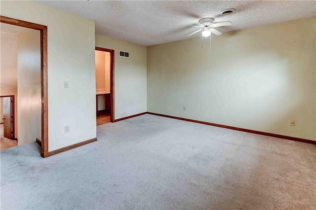 unfurnished bedroom with light colored carpet, visible vents, and baseboards