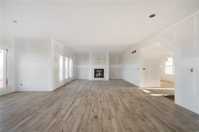 unfurnished living room with light wood-type flooring