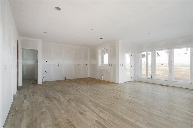 unfurnished living room with light hardwood / wood-style floors