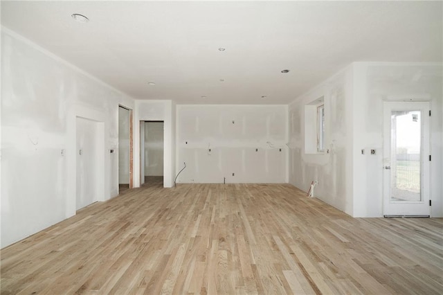 unfurnished living room with light hardwood / wood-style flooring