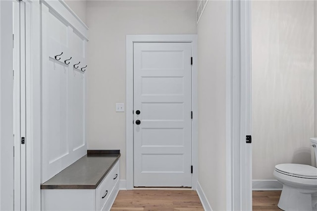 mudroom featuring light wood-type flooring and baseboards
