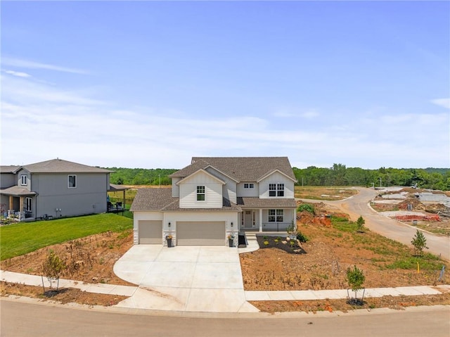 25010 W 142nd St, Olathe, KS 66061 - view of front of house with driveway, a porch, a garage, a front lawn, and an attached garage