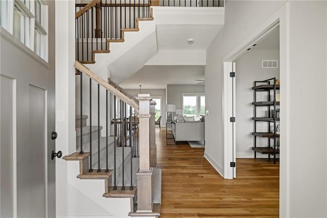 25010 W 142nd St, Olathe, KS 66061 - foyer entrance with wood finished floors, stairway, and a high ceiling