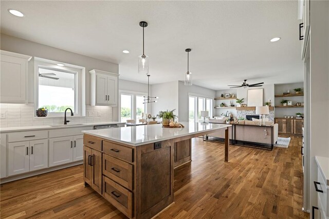 25010 W 142nd St, Olathe, KS 66061 - kitchen featuring a ceiling fan, recessed lighting, tasteful backsplash, light countertops, and white cabinetry