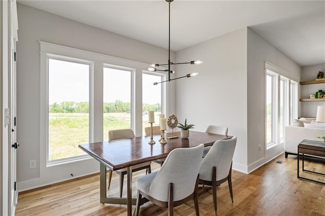 25010 W 142nd St, Olathe, KS 66061 - dining room with a chandelier and light wood-style flooring