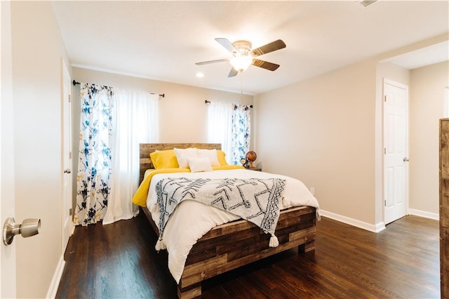 bedroom with dark wood-type flooring and ceiling fan