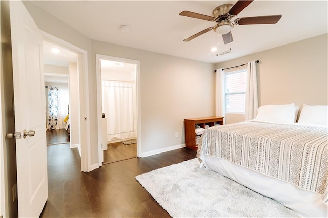 bedroom featuring ensuite bath, ceiling fan, and dark hardwood / wood-style flooring