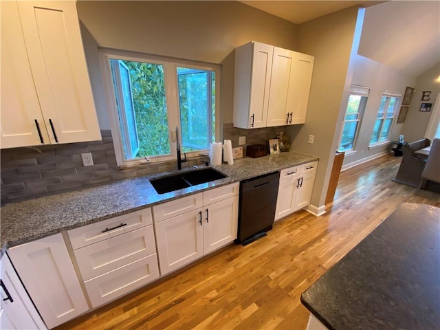 kitchen featuring light wood-type flooring, white cabinets, dishwasher, and a healthy amount of sunlight