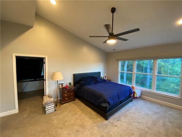 bedroom with lofted ceiling, ceiling fan, and carpet floors