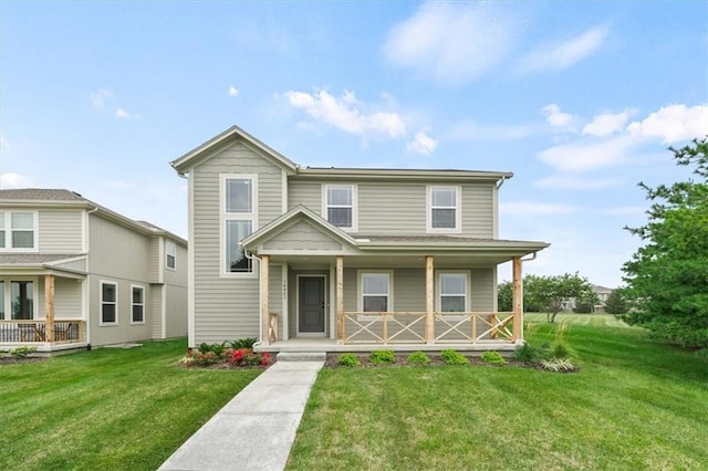 front of property featuring covered porch and a front lawn