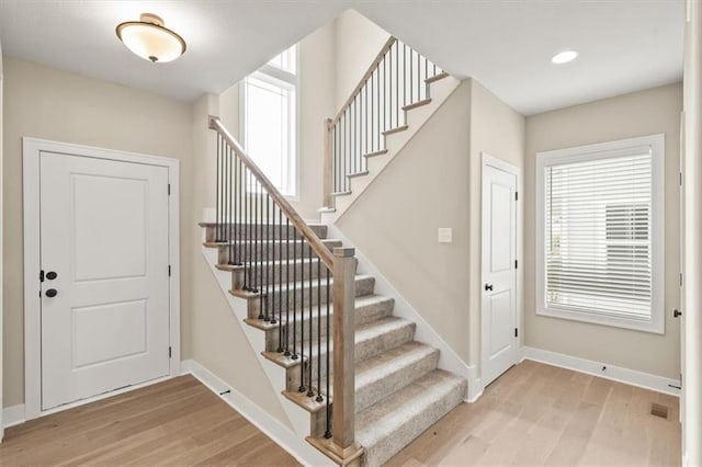 entryway featuring plenty of natural light and light hardwood / wood-style floors